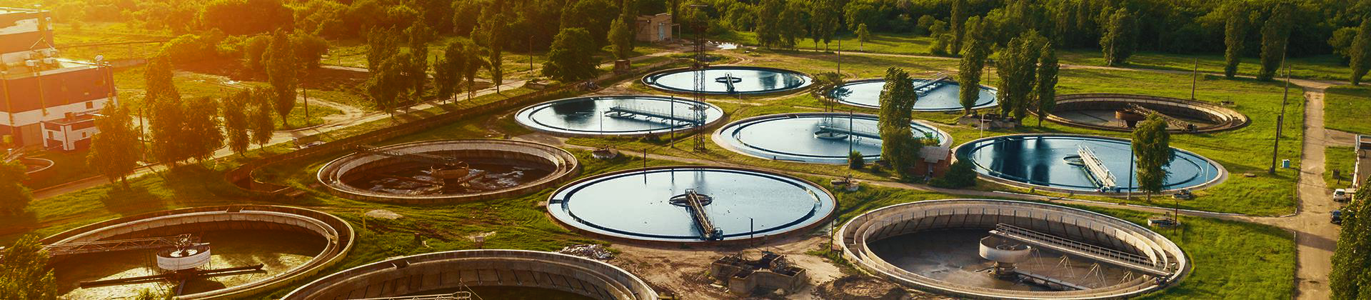 Aerial view of multiple municipal wastewater treatment tanks