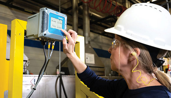 Woman in field using Hach SC4500 Digital Controller